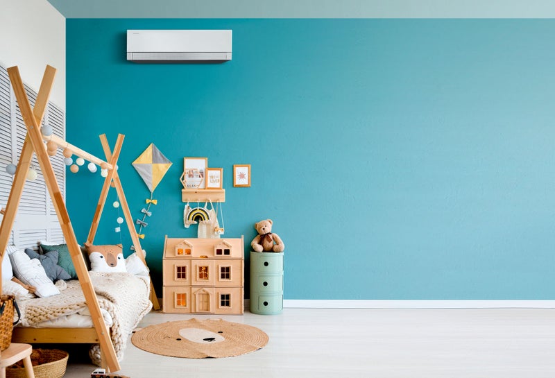 Stylish baby room with toys, wooden bed and mock up poster frame. Cute home decor. Scandinavian interior of a children's room.
