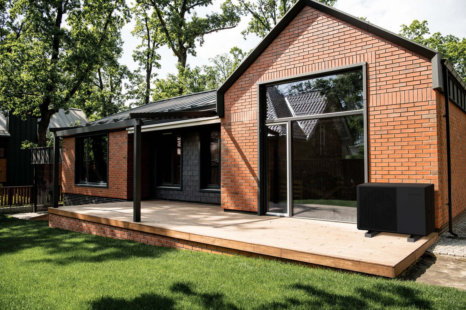 property market, brick cottage with large panoramic windows, patio, green lawn