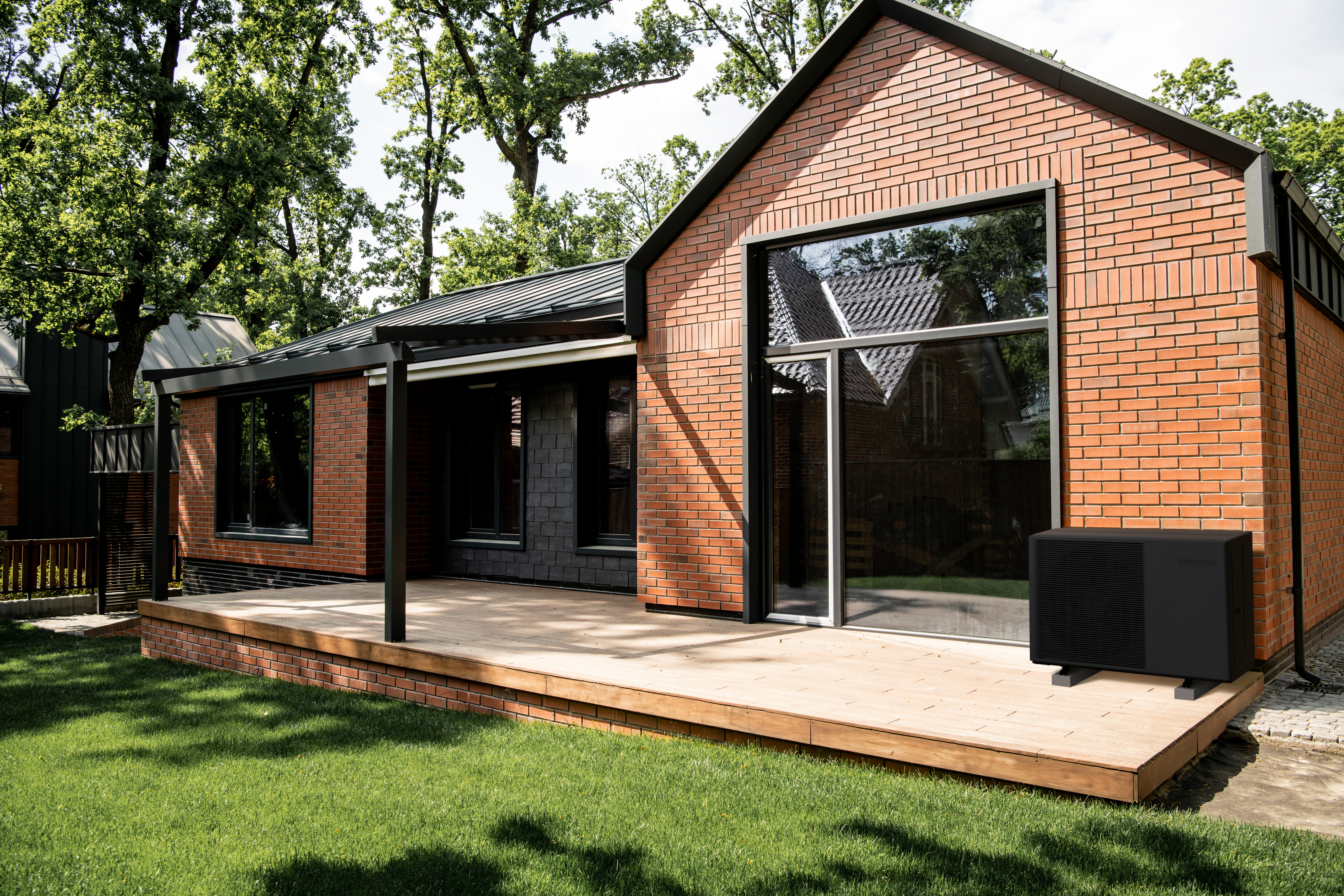 property market, brick cottage with large panoramic windows, patio, green lawn