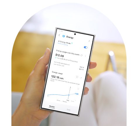 A hand holds a phone with SmartThings' Energy tab onscreen. AI energy mode is on. Monthly energy consumption is 122.18 kWh and costs $12.09.